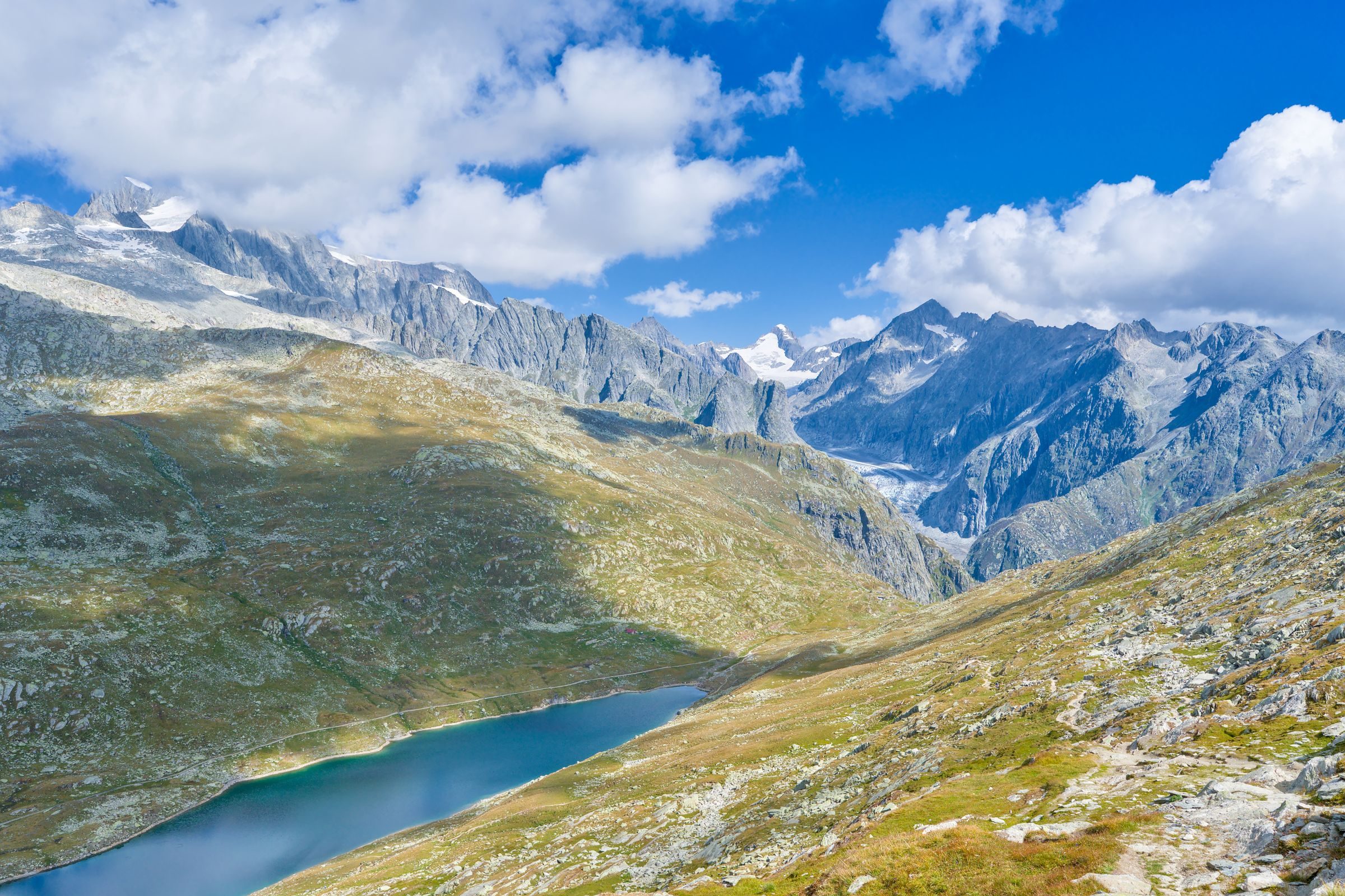 An alpine lake below rugged Swiss peaks